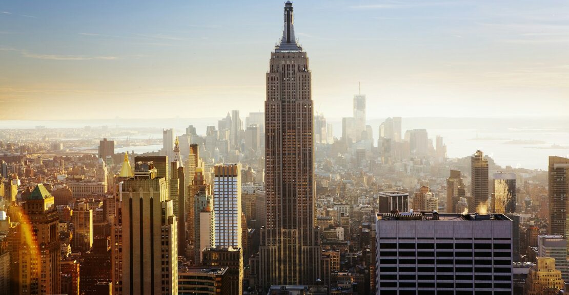 Aerial view of the Empire State Building and NYC skyline.